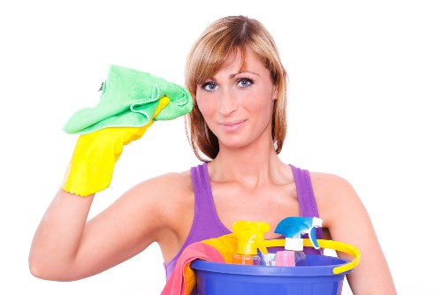 Office cleaner maintaining a bright reception area in a local business premises