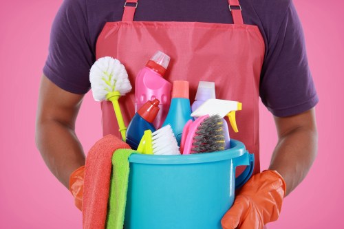 Technician preparing equipment for sofa cleaning service