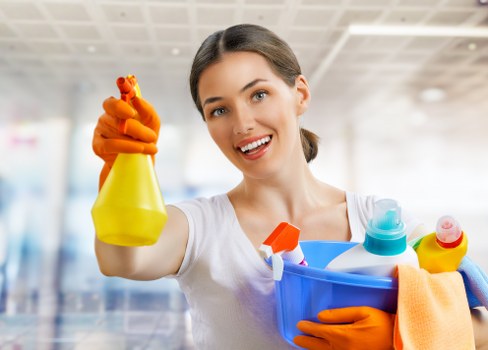 Professional carpet cleaner inspecting a living room carpet