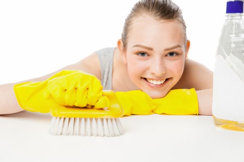 Technician carrying out sofa cleaning in a home with access considerations