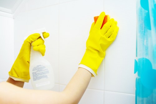 Deep cleaning team vacuuming and mopping a tidy family home
