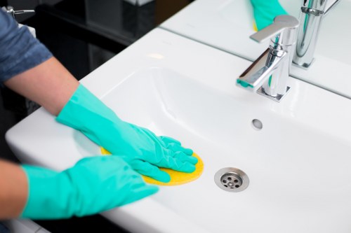 Technician using deep carpet cleaning method on office flooring