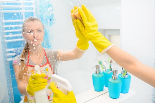 Professional cleaners maintaining an office reception area